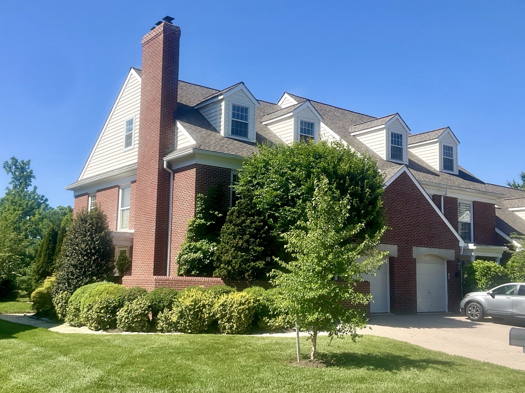Home inspection by Michael Kelley — large brick colonial with tall chimney in Maple Glen, Pennsylvania