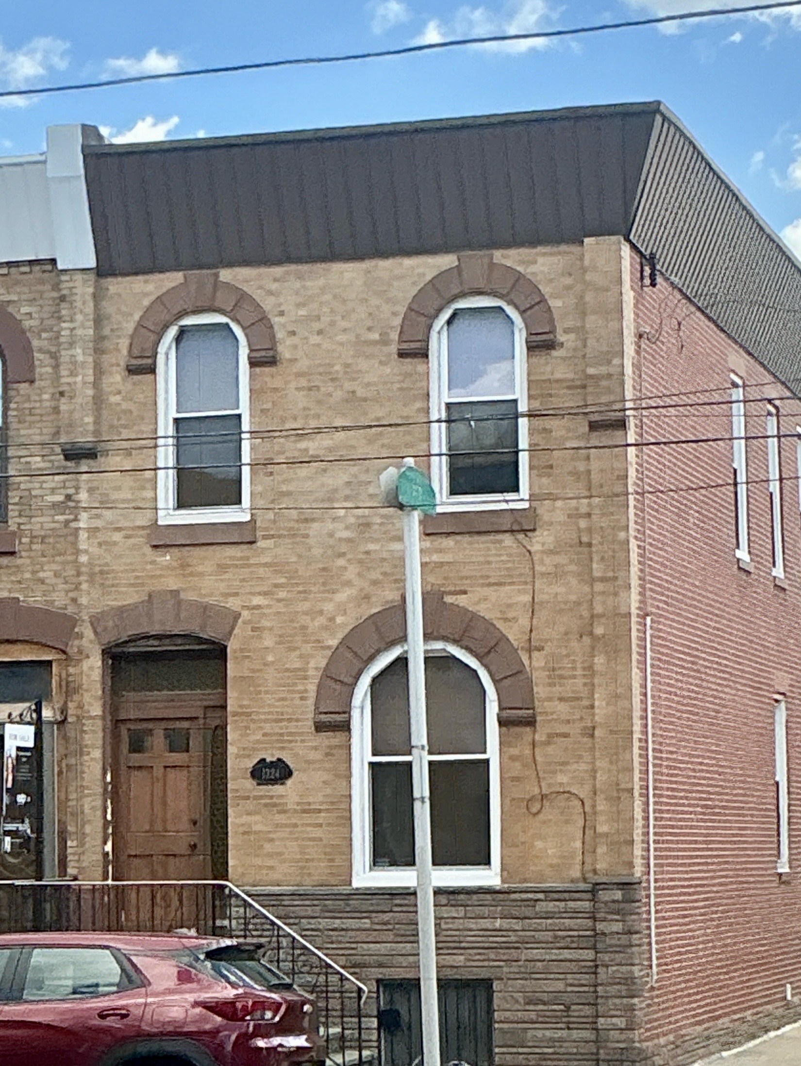 Home inspection by Joe Topper — buff-brick corner rowhome with arched windows in Newbold, Philadelphia