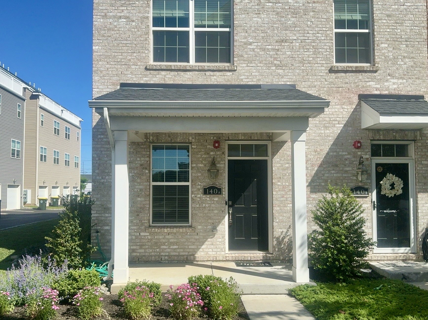 Home inspection by Todd Denney — new-construction brick twin townhome with covered porch in Bensalem, Pennsylvania