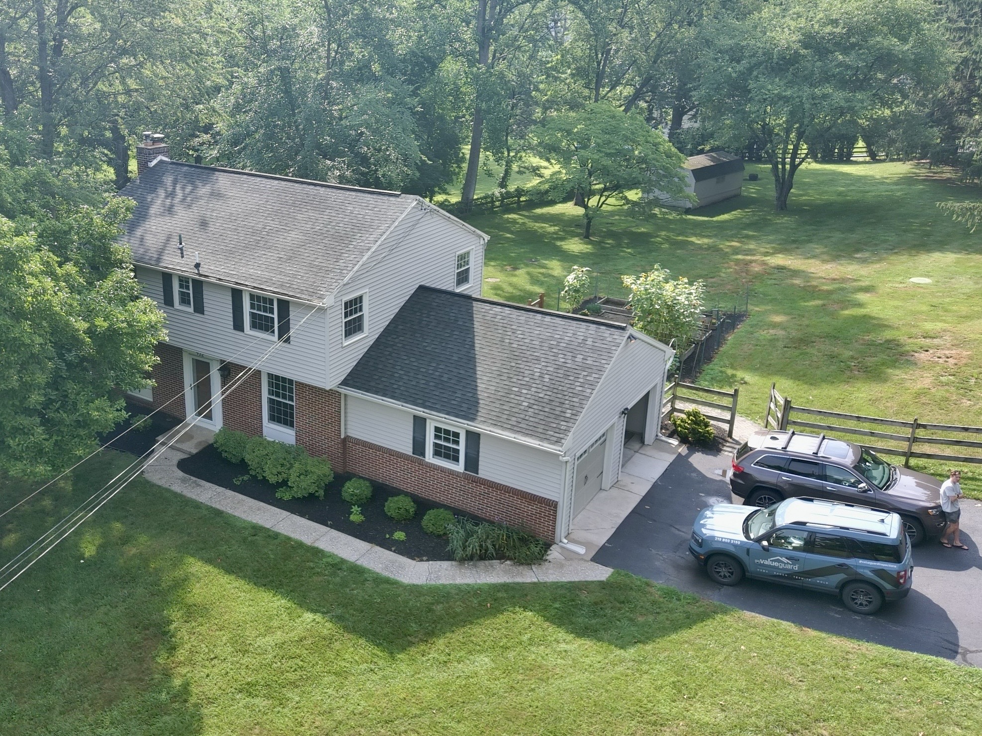 Aerial home inspection by Cory Shalaway — brick-and-clapboard colonial with gambrel roof in West Chester, Pennsylvania