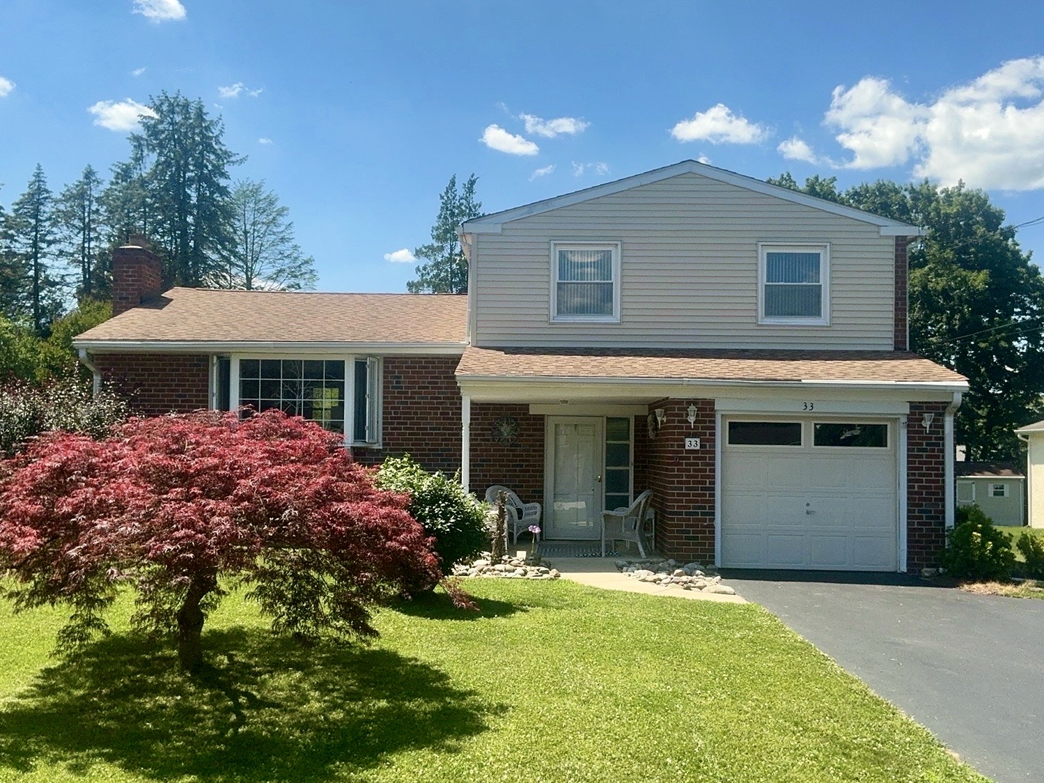 Home inspection by Todd Denney — brick-and-siding split-level home with attached garage in Malvern, Pennsylvania