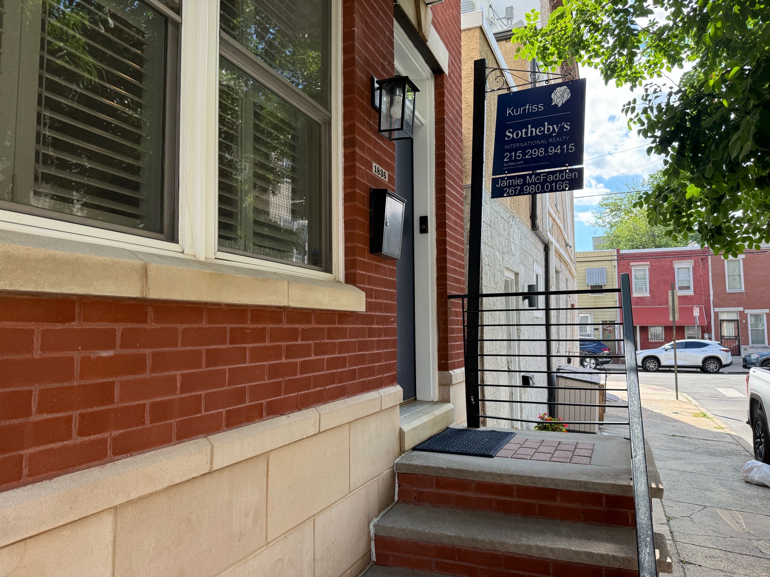 Home inspection by Todd Denney — red-brick rowhome with bay window and stone base in Point Breeze, Philadelphia