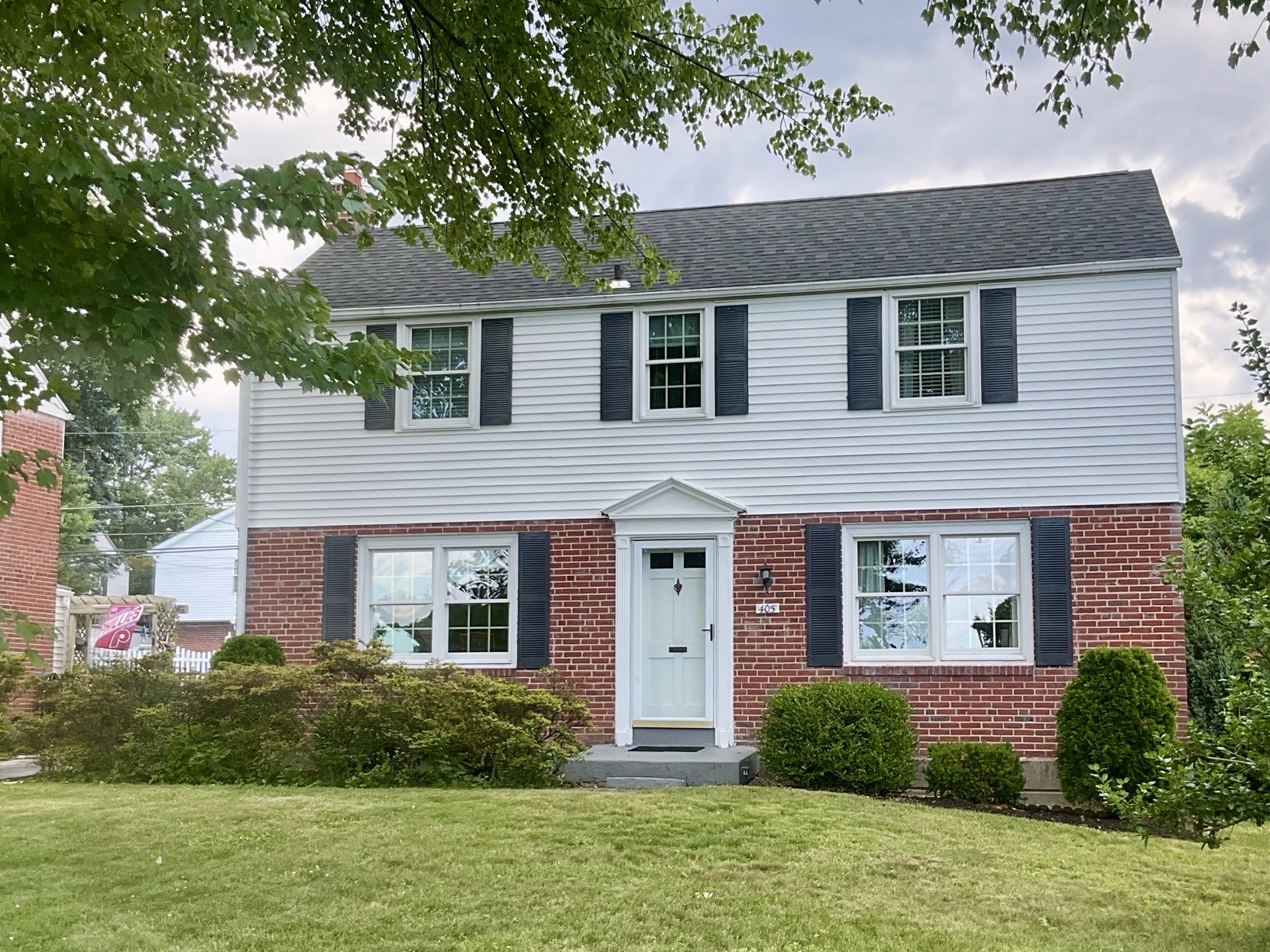 Home inspection by James Royer — brick-and-clapboard center-hall colonial with black shutters in Havertown, Pennsylvania