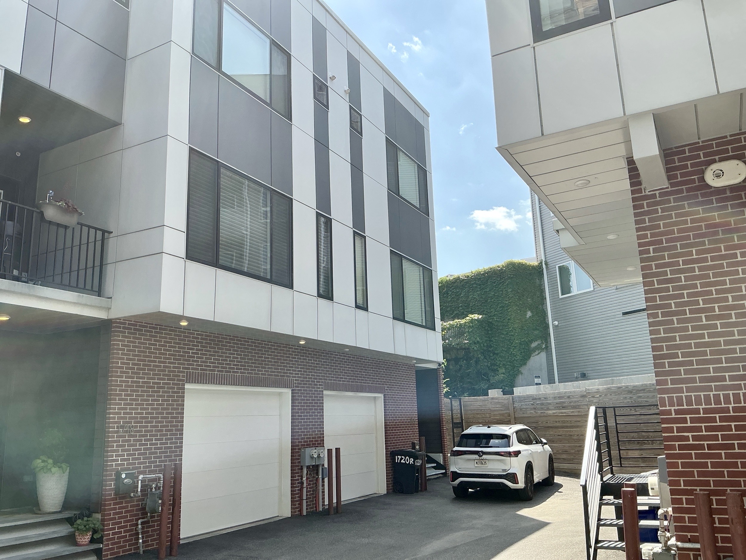 Home inspection by Steven Haslam — modern new-construction townhome with fiber-cement facade and two-car garage in Fishtown, Philadelphia