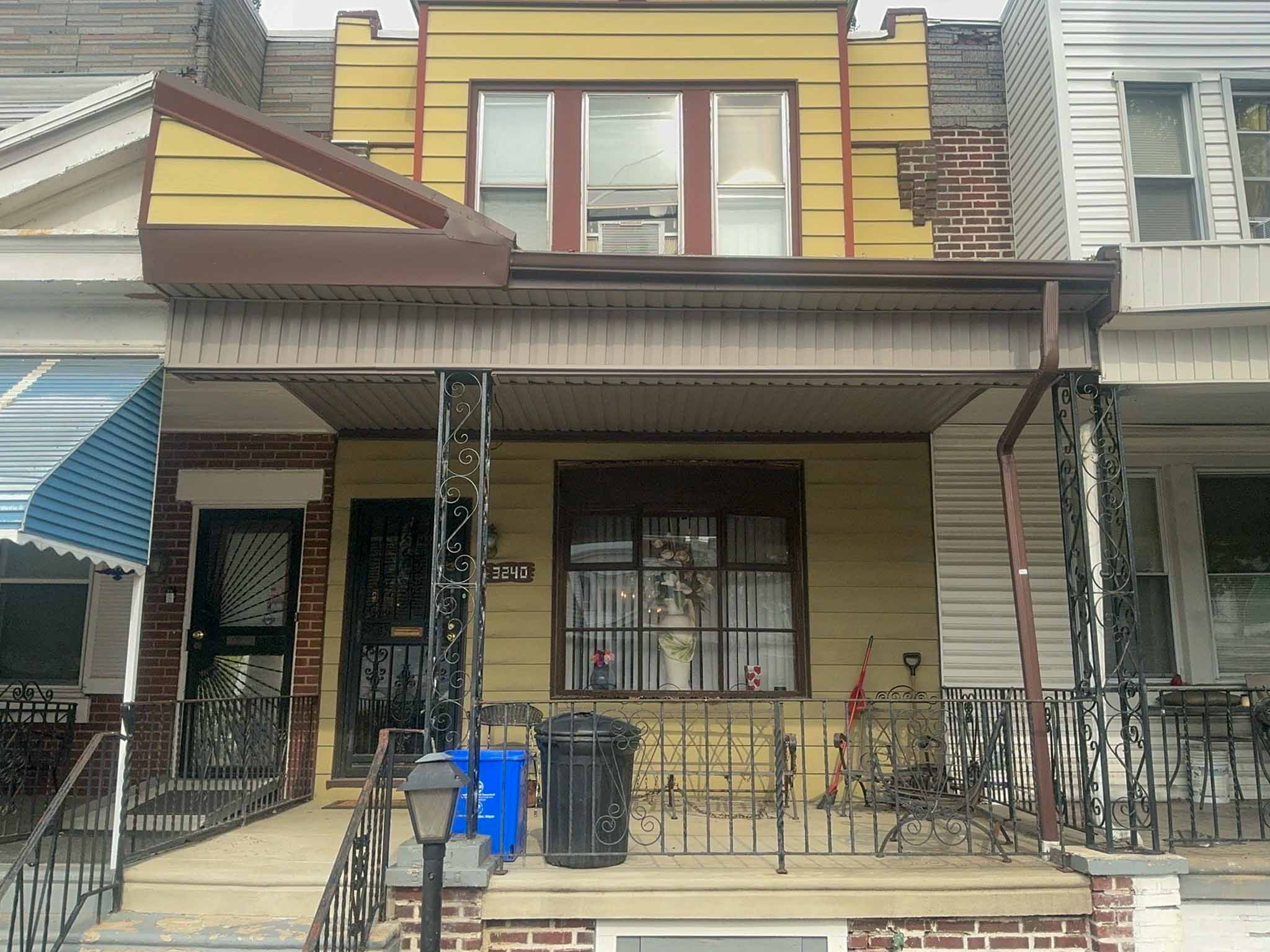ValueGuard home inspection — early-1900s porch-front rowhome with ornate iron railings in East Falls Philadelphia