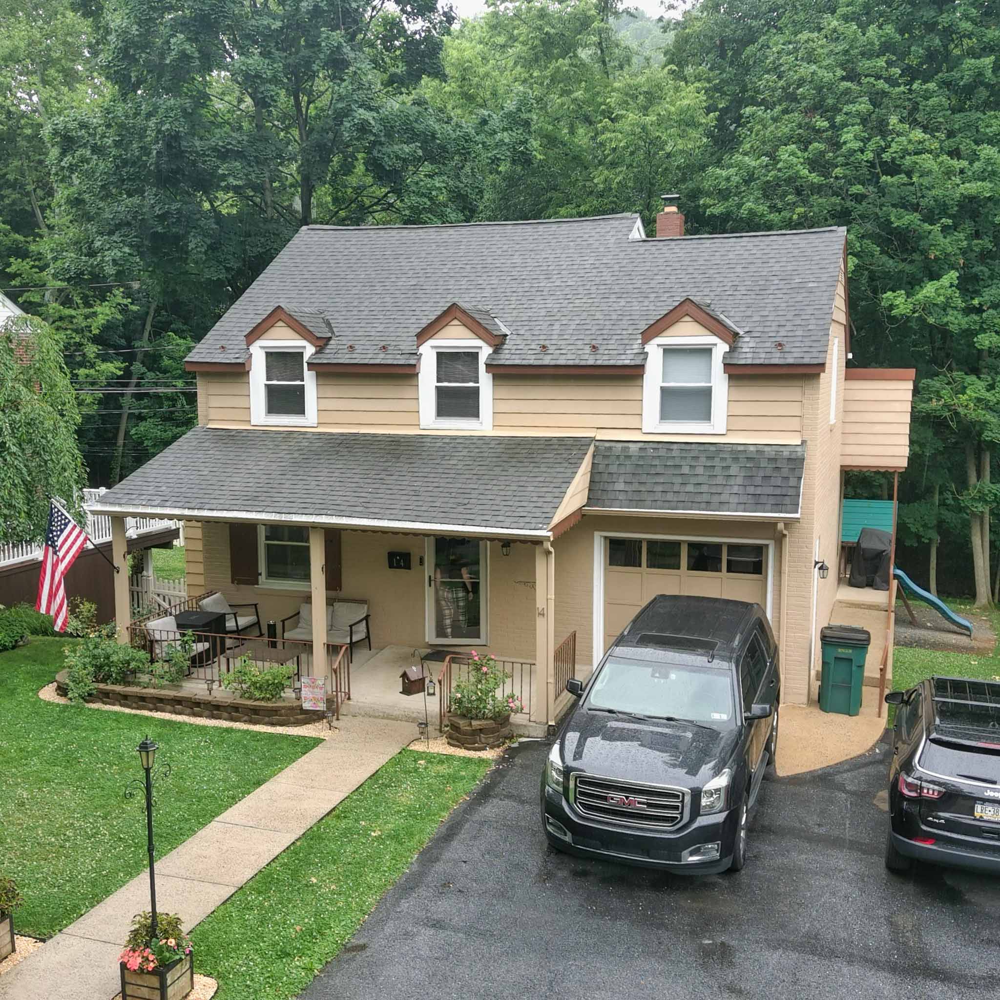 Yellow Dutch Colonial with a gambrel roof, front dormers and a covered porch in Reading, Berks County inspected by ValueGuard home inspectors