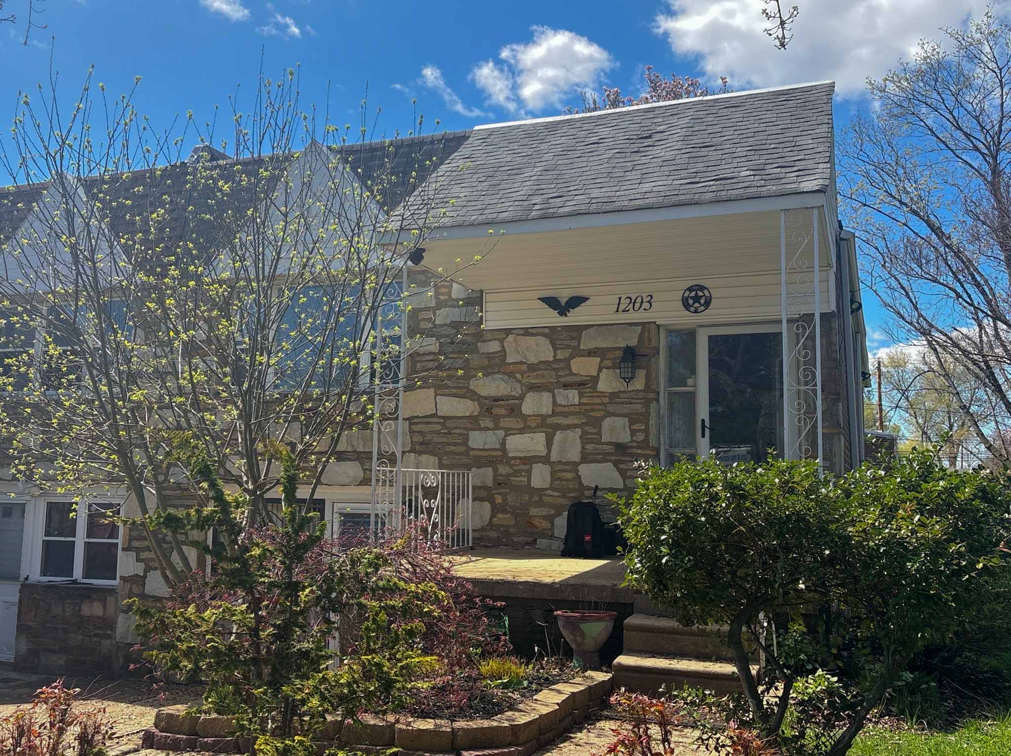 ValueGuard home inspection — post-war two-story brick-base single with vinyl-clad upper level and bay window on a grass lot in the Far Northeast Philadelphia