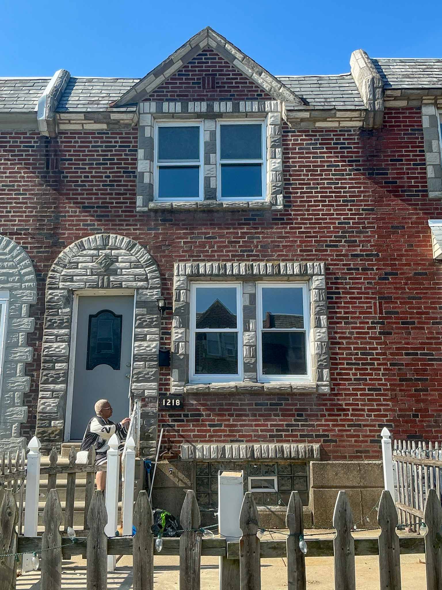 ValueGuard home inspection — mid-century stone-front colonial with attached sunroom and ornamental ironwork in Northeast Philadelphia