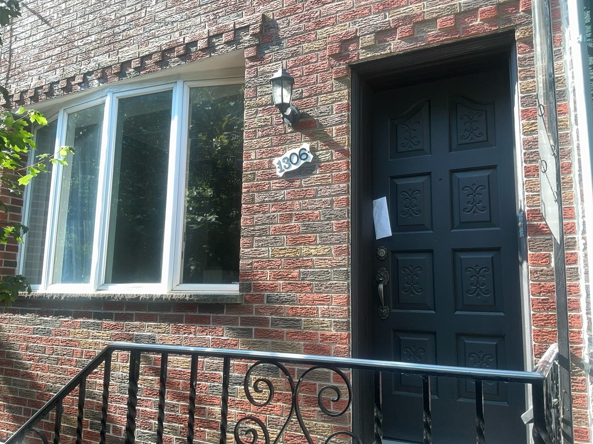 Home inspection by Todd Denney — tapestry-brick rowhome with bay window and ornate door in Passyunk Square, Philadelphia