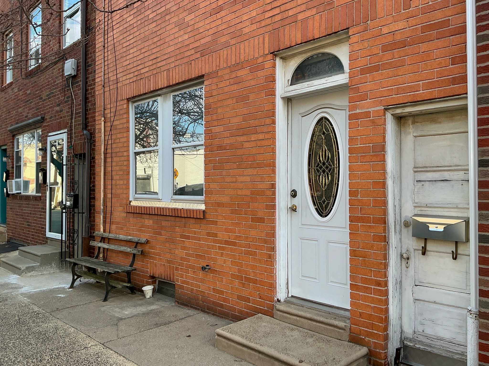 ValueGuard home inspection — Port Richmond bay-fronted rowhome streetscape with recently renovated for-sale listing