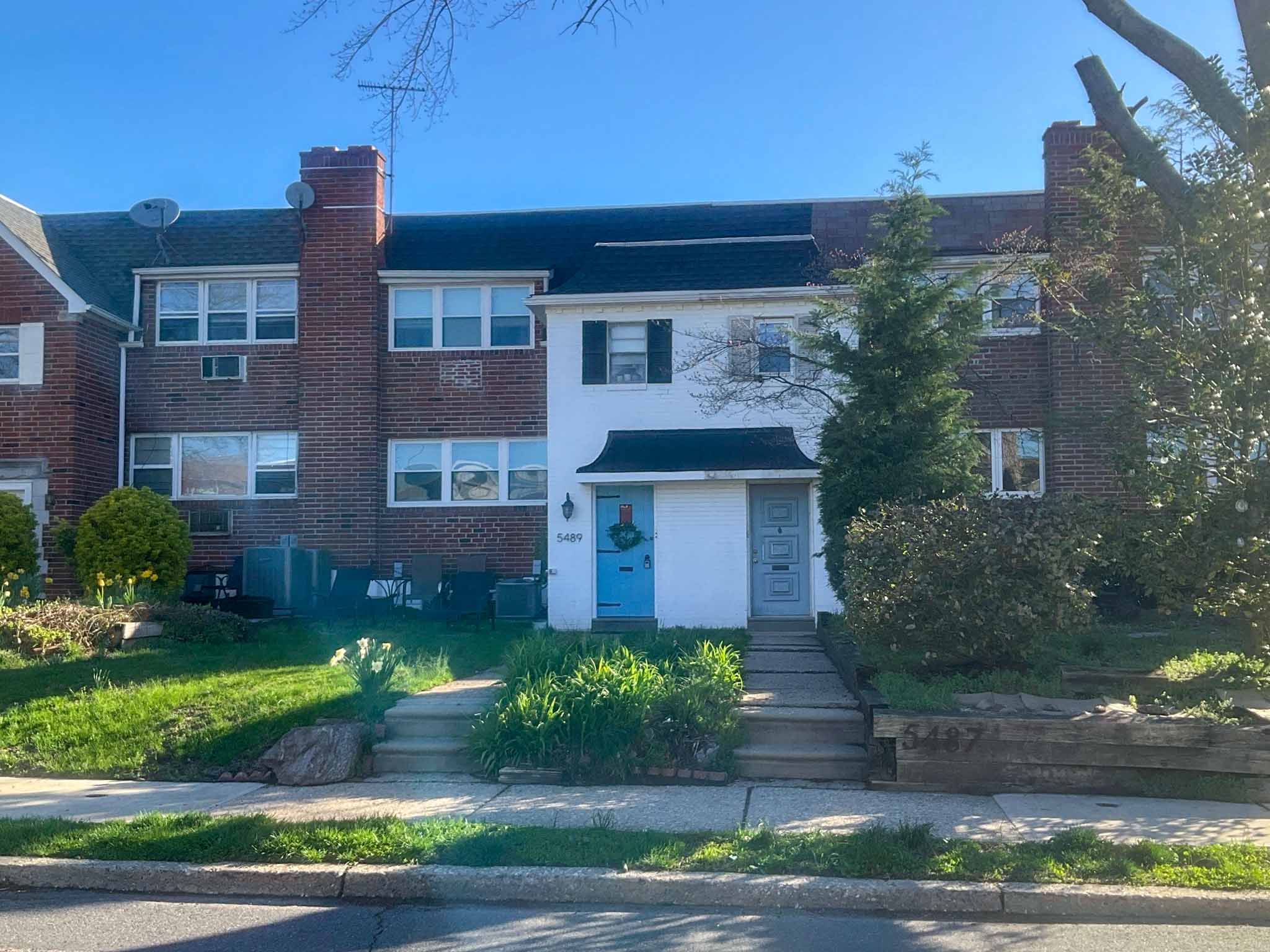 ValueGuard home inspection — mid-century brick twin streetscape with mansard entry canopies in Roxborough Philadelphia