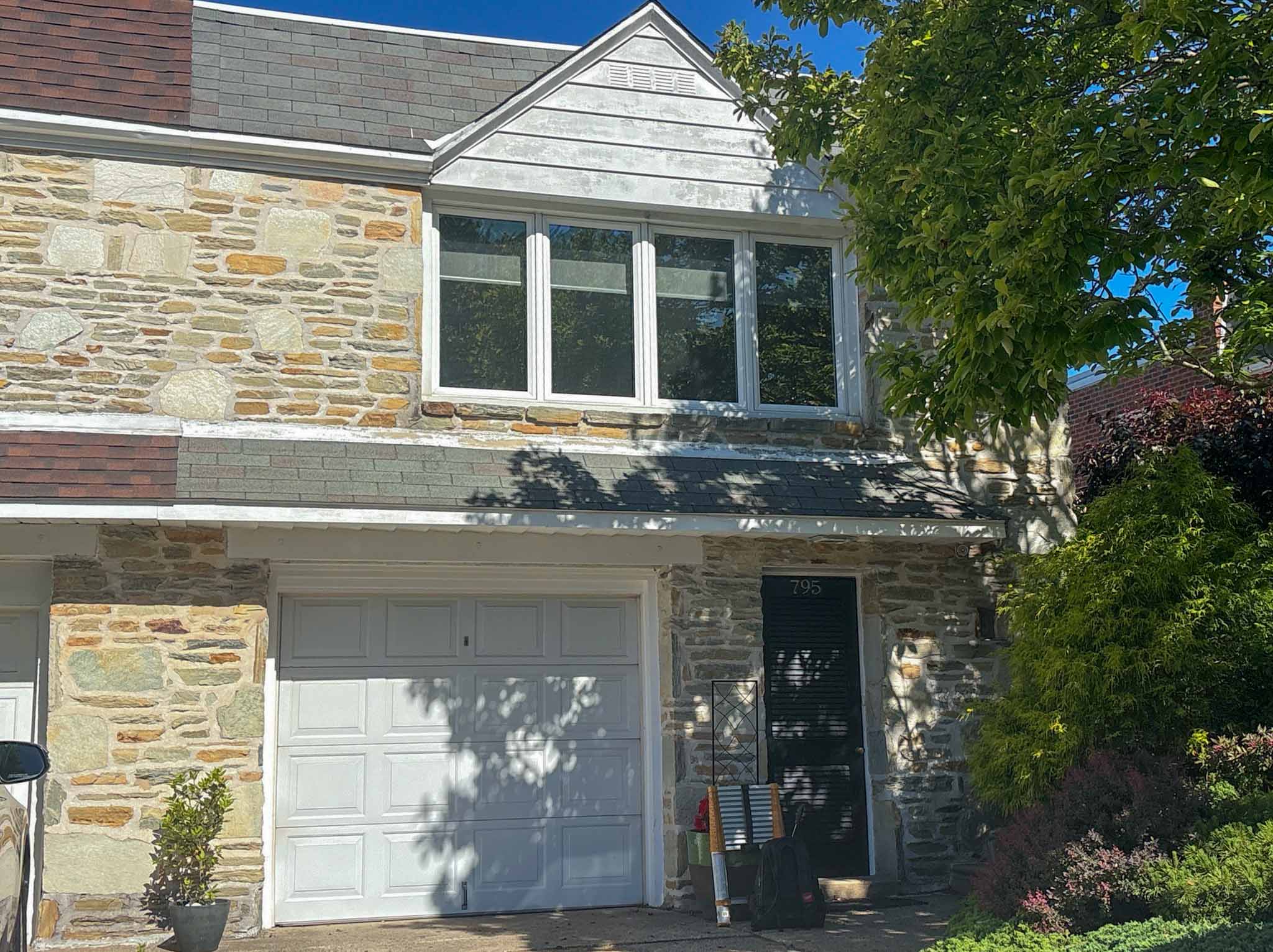 ValueGuard home inspection — early-1900s brick porch-front rowhome with bay window in Roxborough Philadelphia