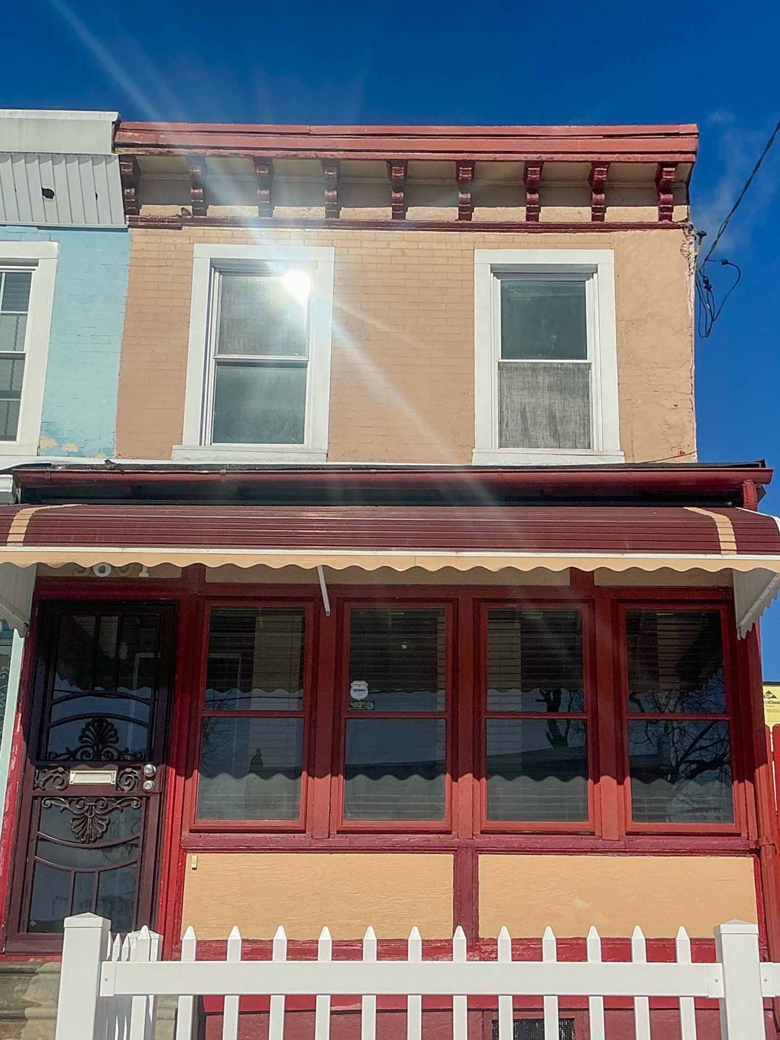 ValueGuard home inspection — projecting three-sided wooden bay window with bracketed cornice and decorative skirt on a Victorian twin in University City Philadelphia