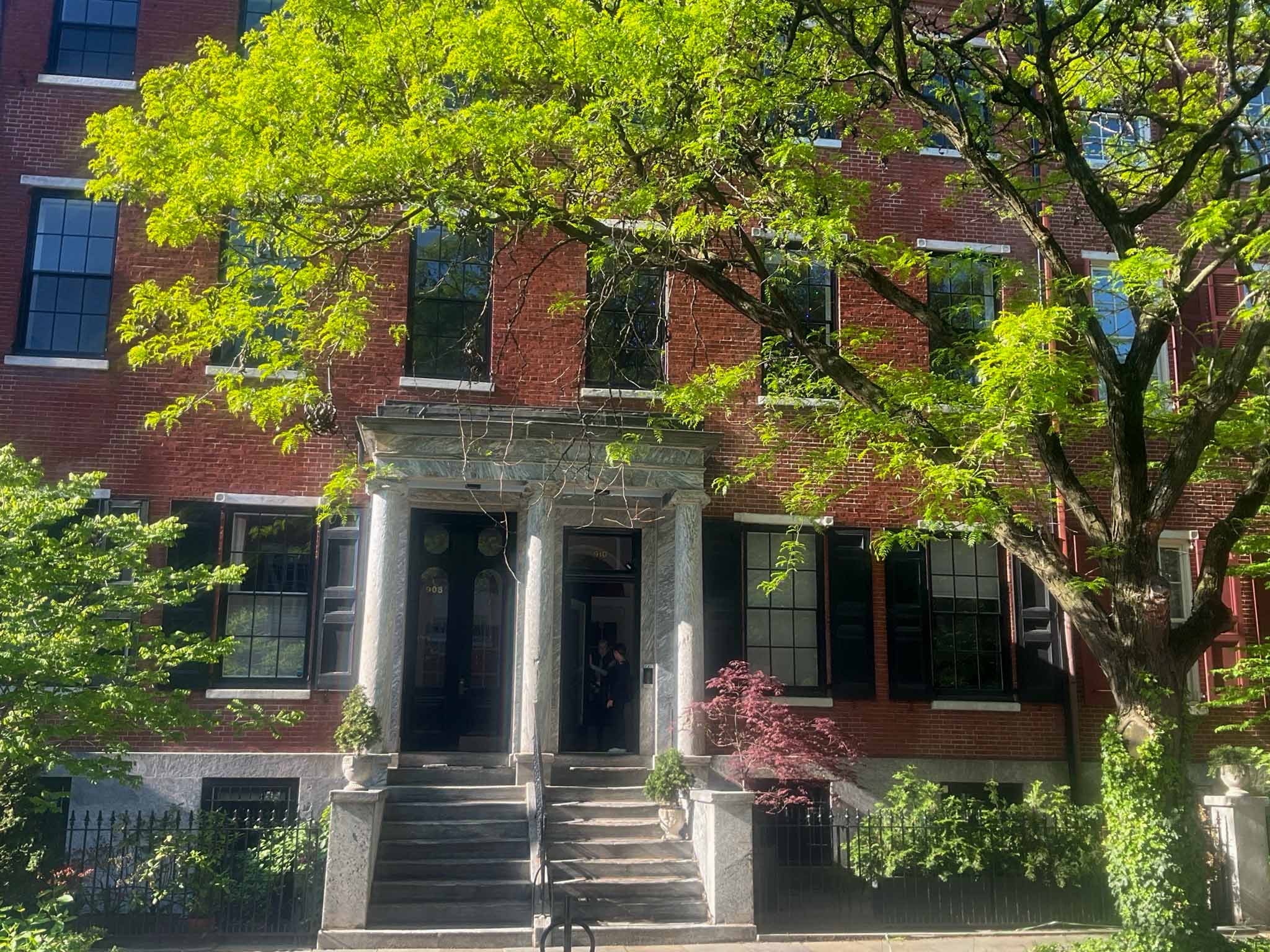 ValueGuard home inspection — Federal-era brick rowhome streetscape with arched fanlight transom and red door in Washington Square West Philadelphia