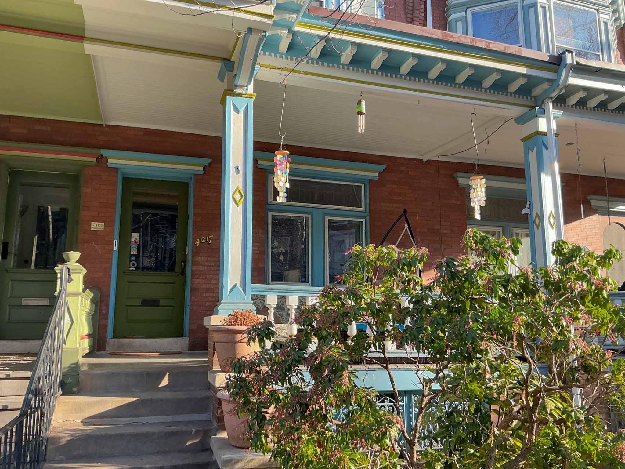 ValueGuard home inspection — three-story Victorian brick rowhouse beside modern brick and metal-clad infill new construction in West Philadelphia