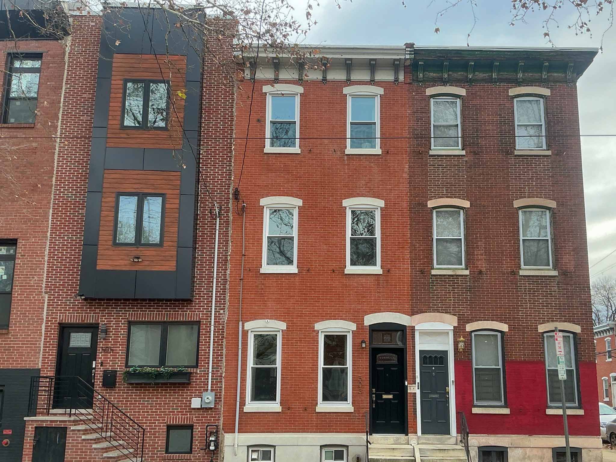 ValueGuard home inspection — compact painted-brick workforce rowhome on side street in West Philadelphia