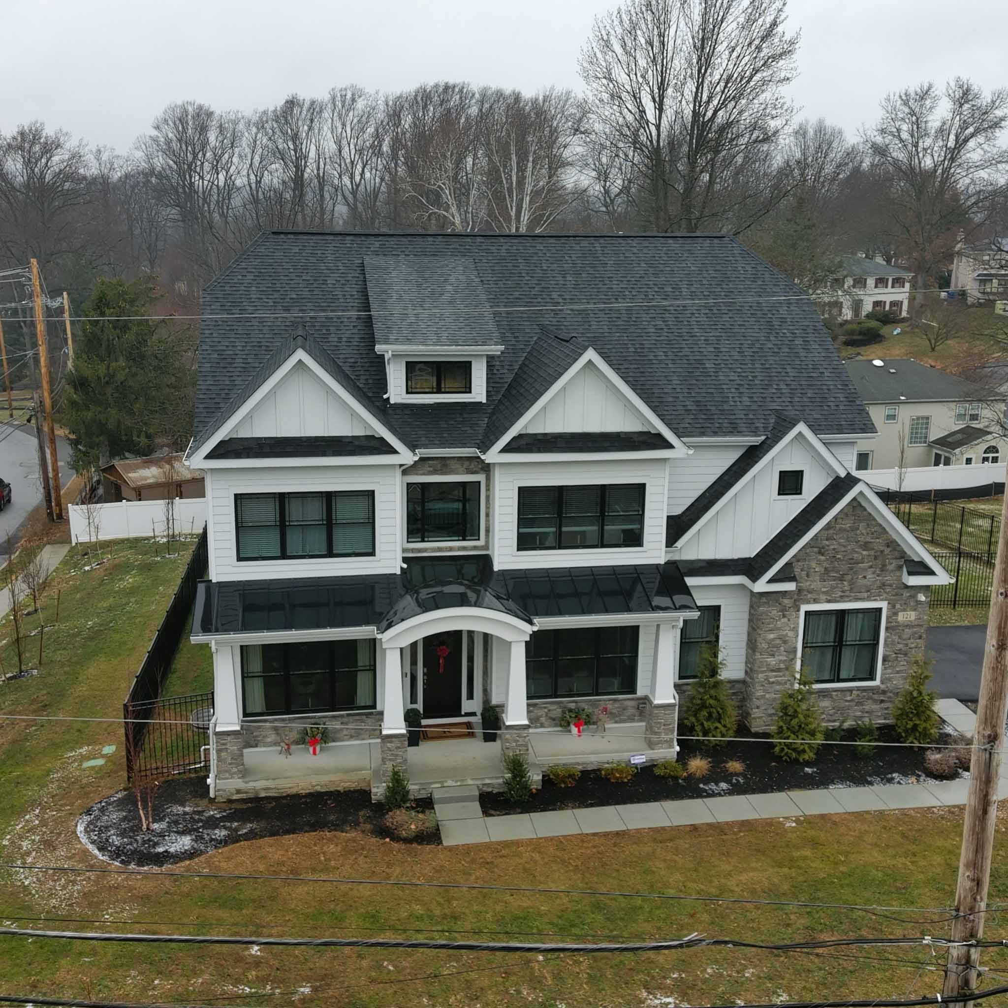 Brand-new Broomall modern farmhouse with stone veneer and board-and-batten siding inspected by a ValueGuard home inspector