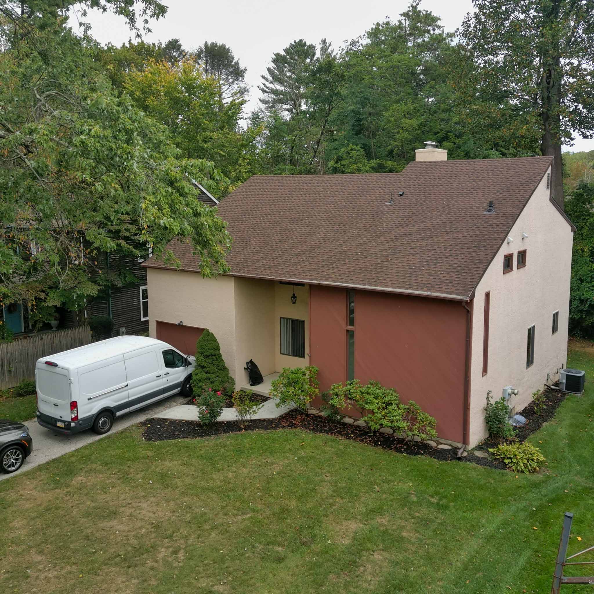 Contemporary stucco home with an asphalt-shingle roof and attached garage in Bryn Mawr inspected by ValueGuard home inspectors