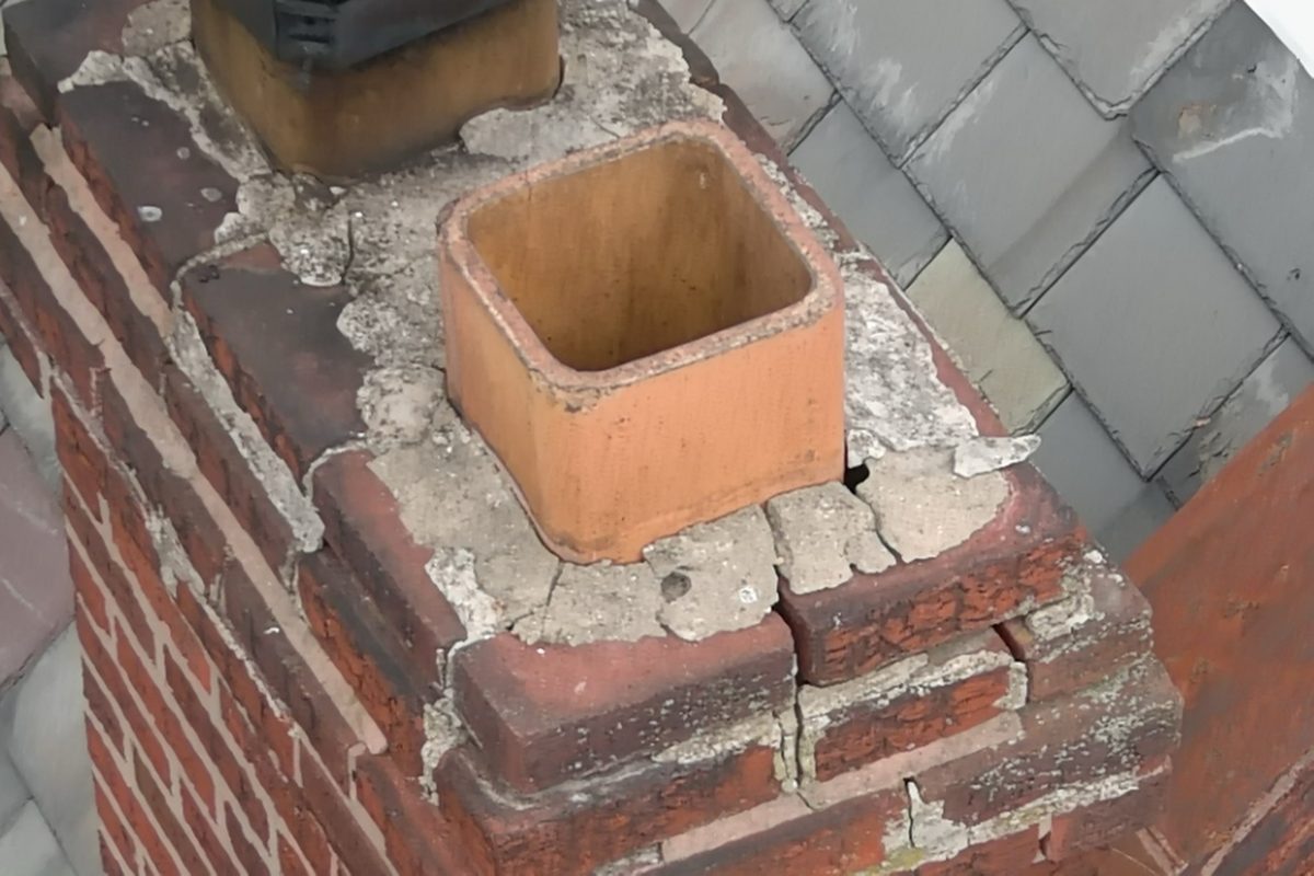 Open clay chimney flue with no cap or spark arrestor and deteriorated mortar