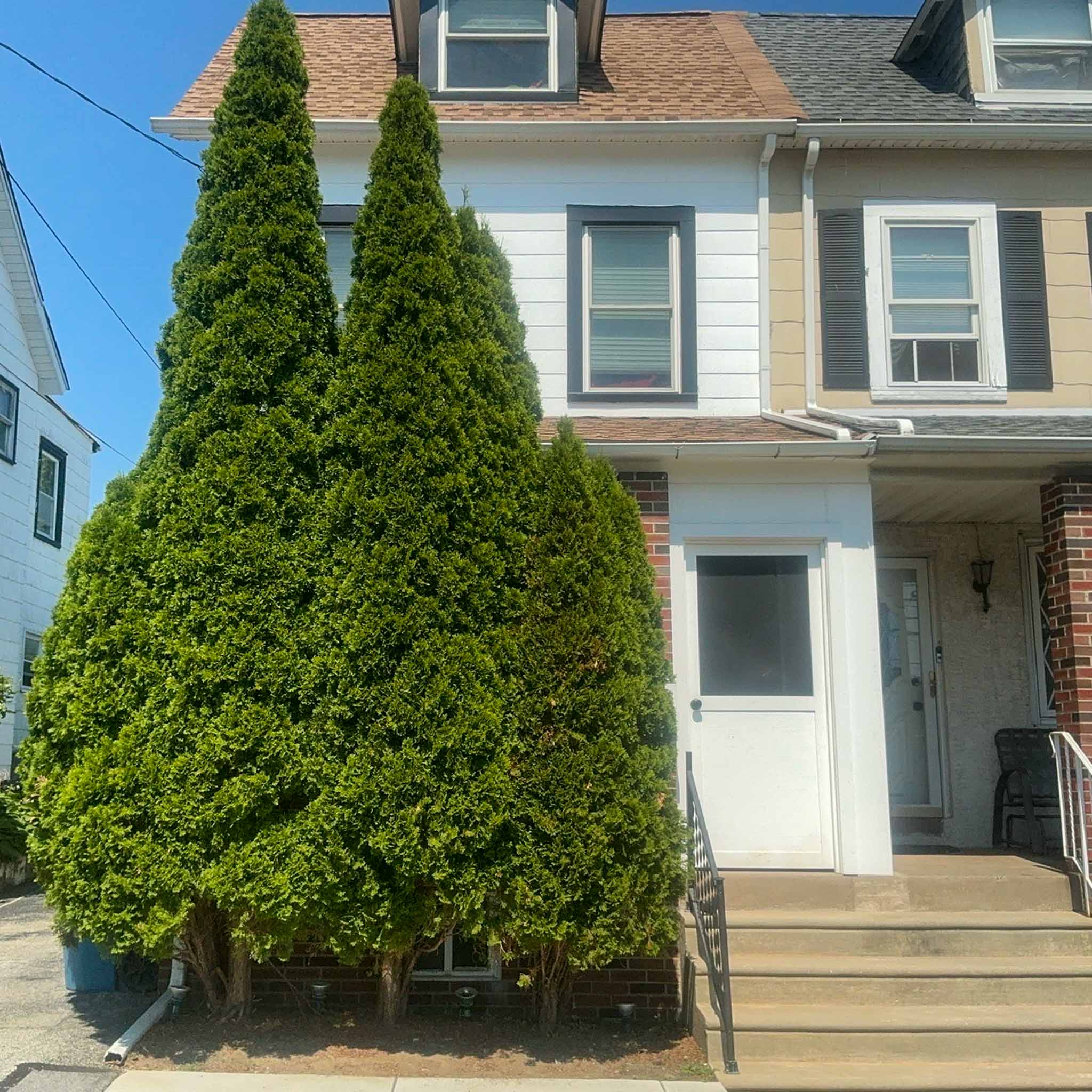 Early-1900s Clifton Heights twin with mansard roof and dormer inspected by a ValueGuard home inspector