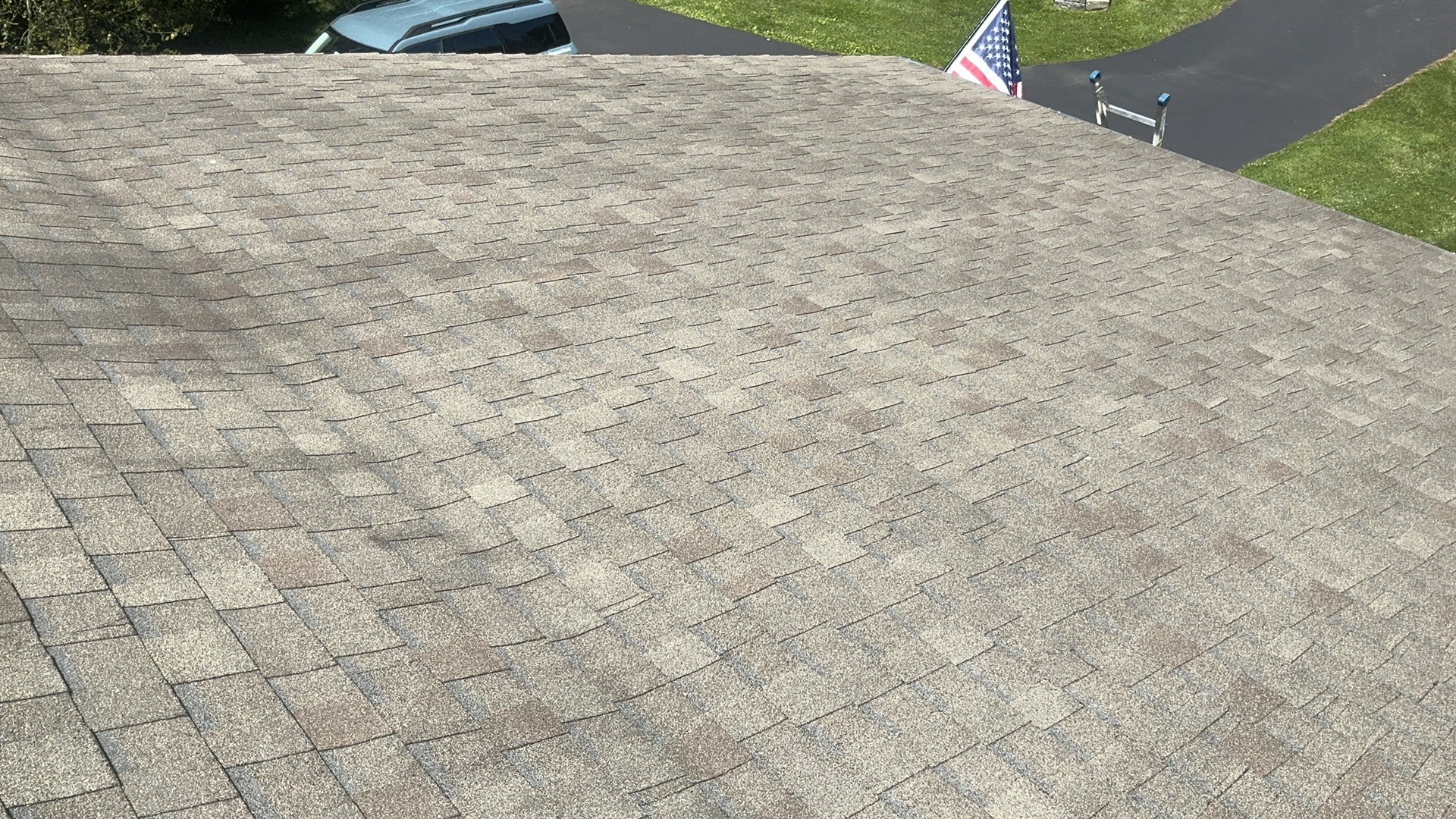 Aerial view of a 10-year-old asphalt shingle roof on a ranch house in Delaware County, Pennsylvania
