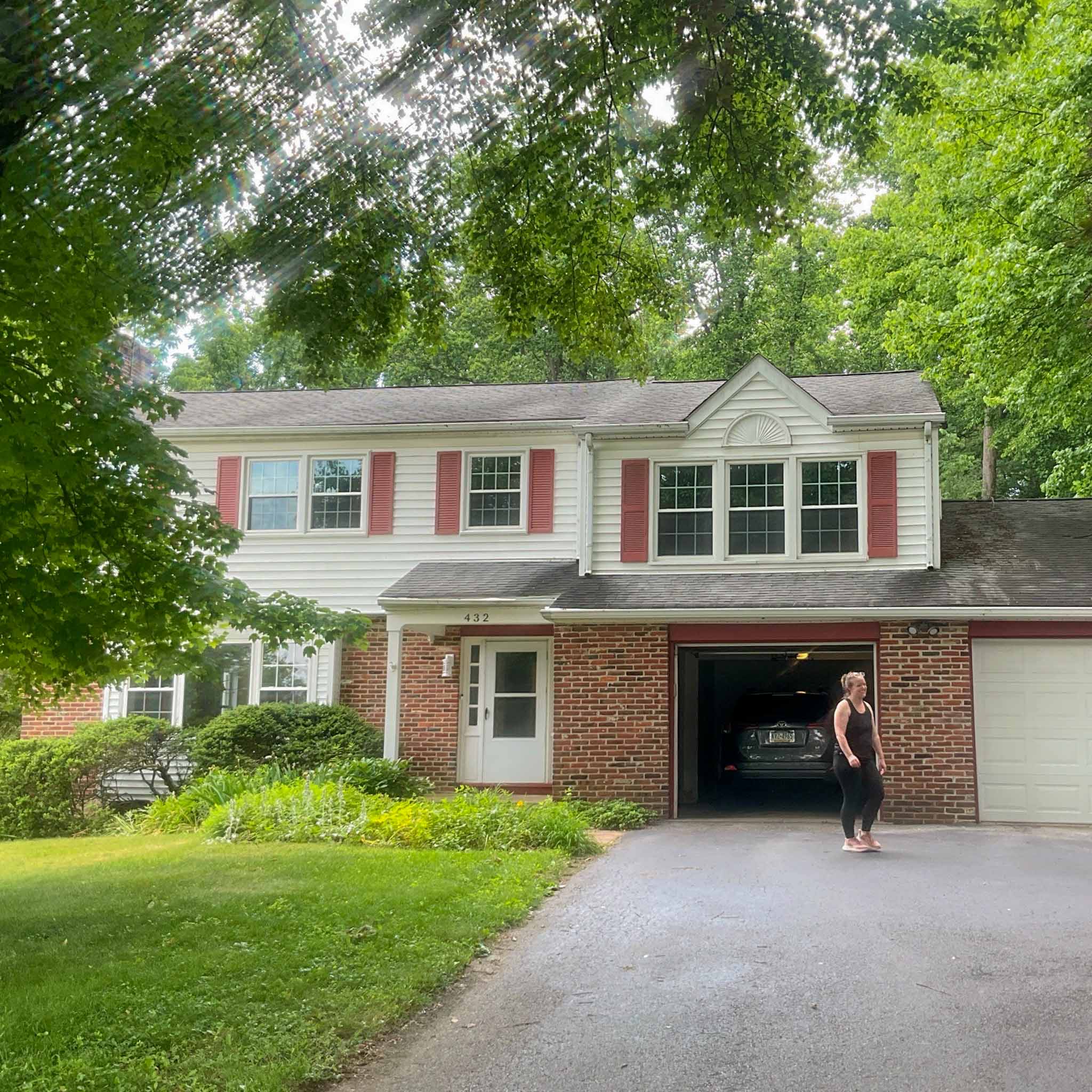 Exton Home Inspection — 1980s Colonial 1980s two-story colonial with white siding, brick first floor and red shutters in Exton, Chester County PA, inspected by ValueGuard home inspectors