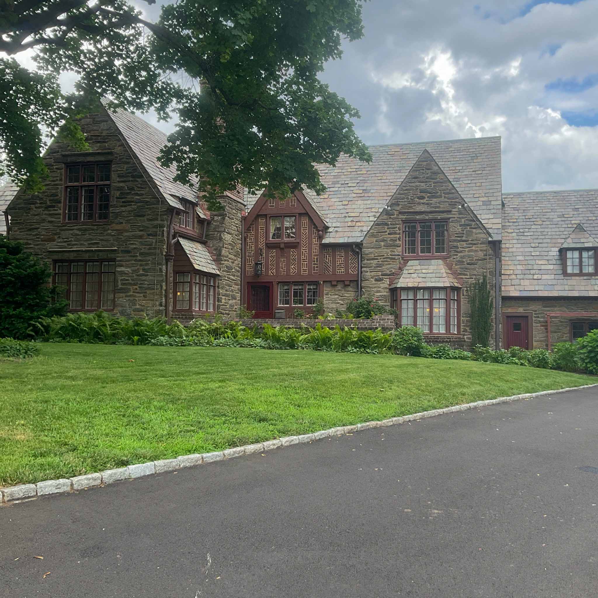 Jenkintown Home Inspection — Stone Tudor with Slate Roof Grand Jenkintown stone Tudor with an aged slate roof, half-timbering and steep gables inspected by a ValueGuard home inspector