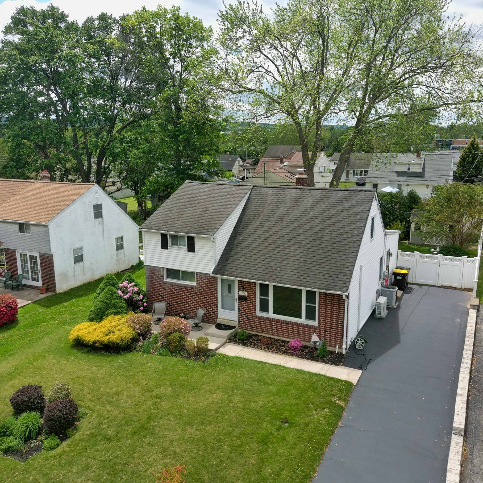 Brick Cape Cod home in King of Prussia, PA with a white-sided dormer addition, inspected by a ValueGuard home inspector