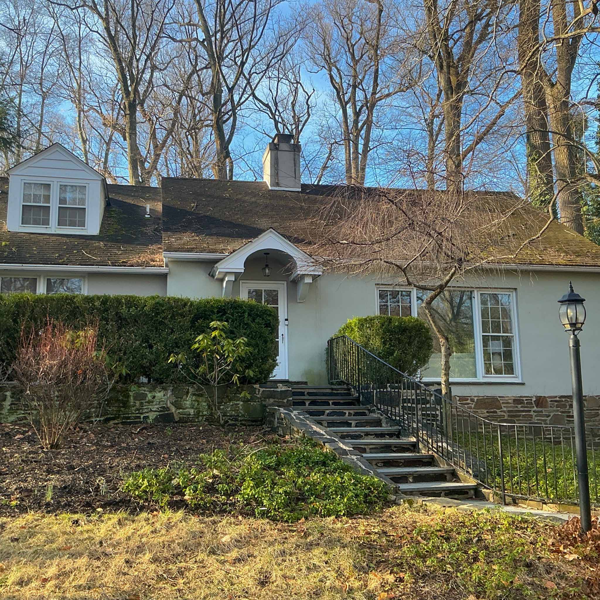 Stucco Media Cape Cod with a front dormer and stone foundation inspected by ValueGuard home inspectors