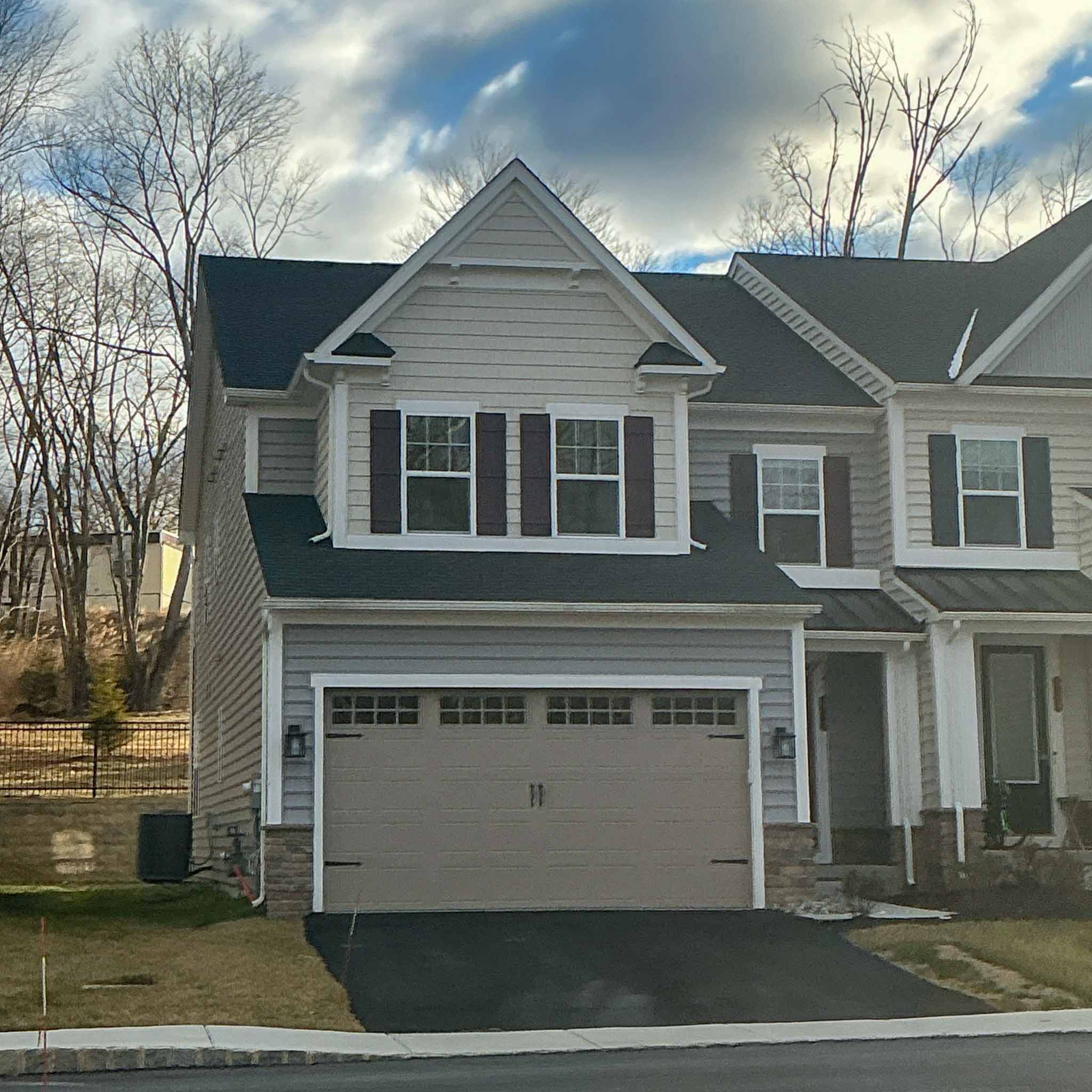 Newer vinyl-sided Media twin with an attached two-car garage inspected by a ValueGuard home inspector
