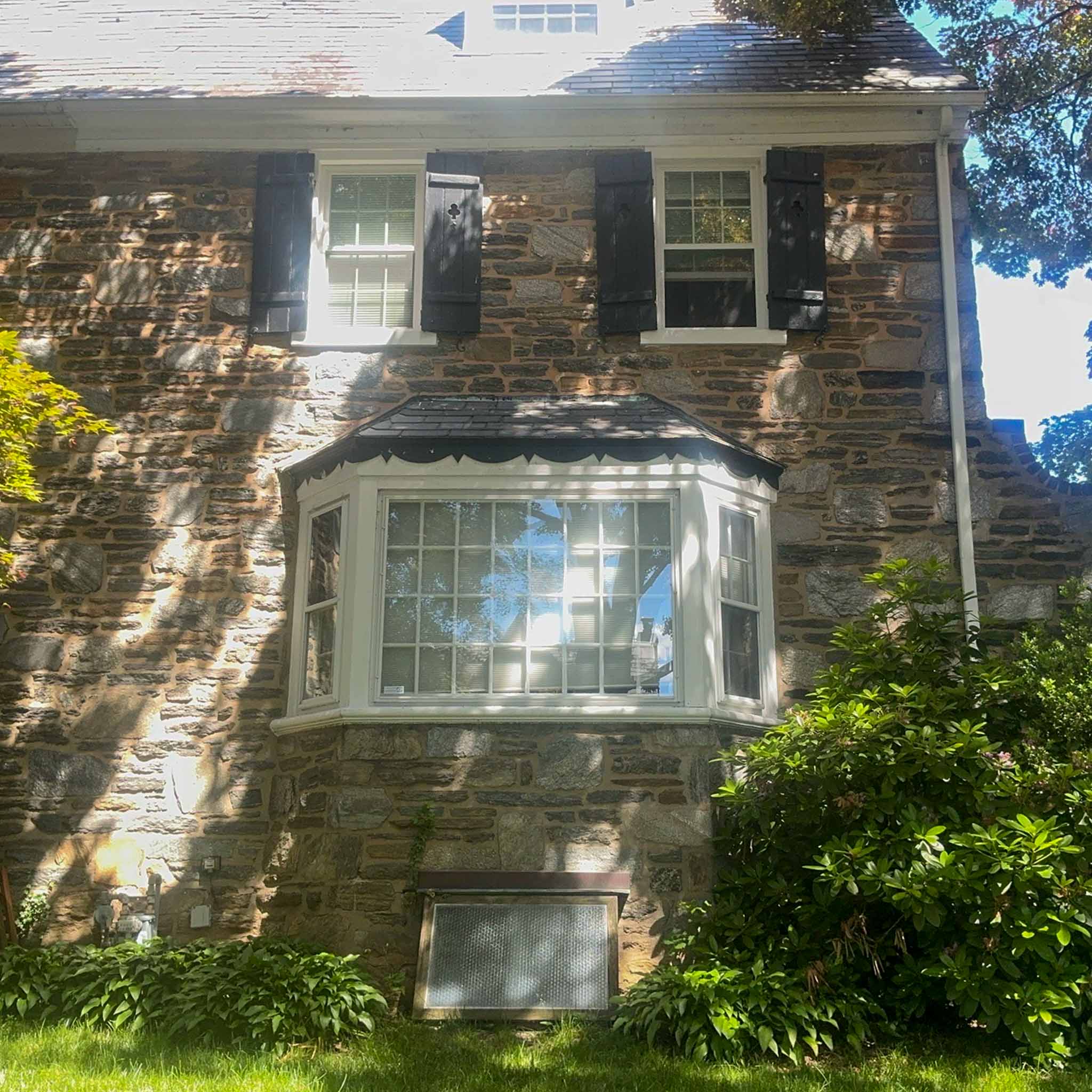 Fieldstone Main Line colonial with a bay window and slate roof in Merion Station inspected by ValueGuard