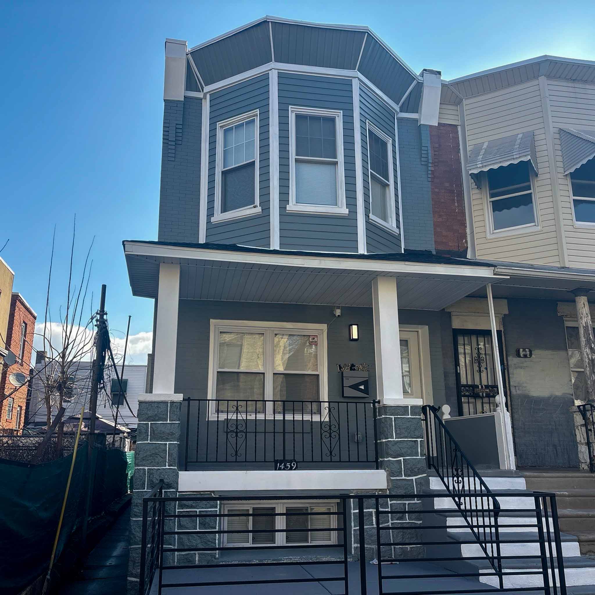 ValueGuard home inspection — porch-front brick rowhome with bay window in Overbrook Philadelphia