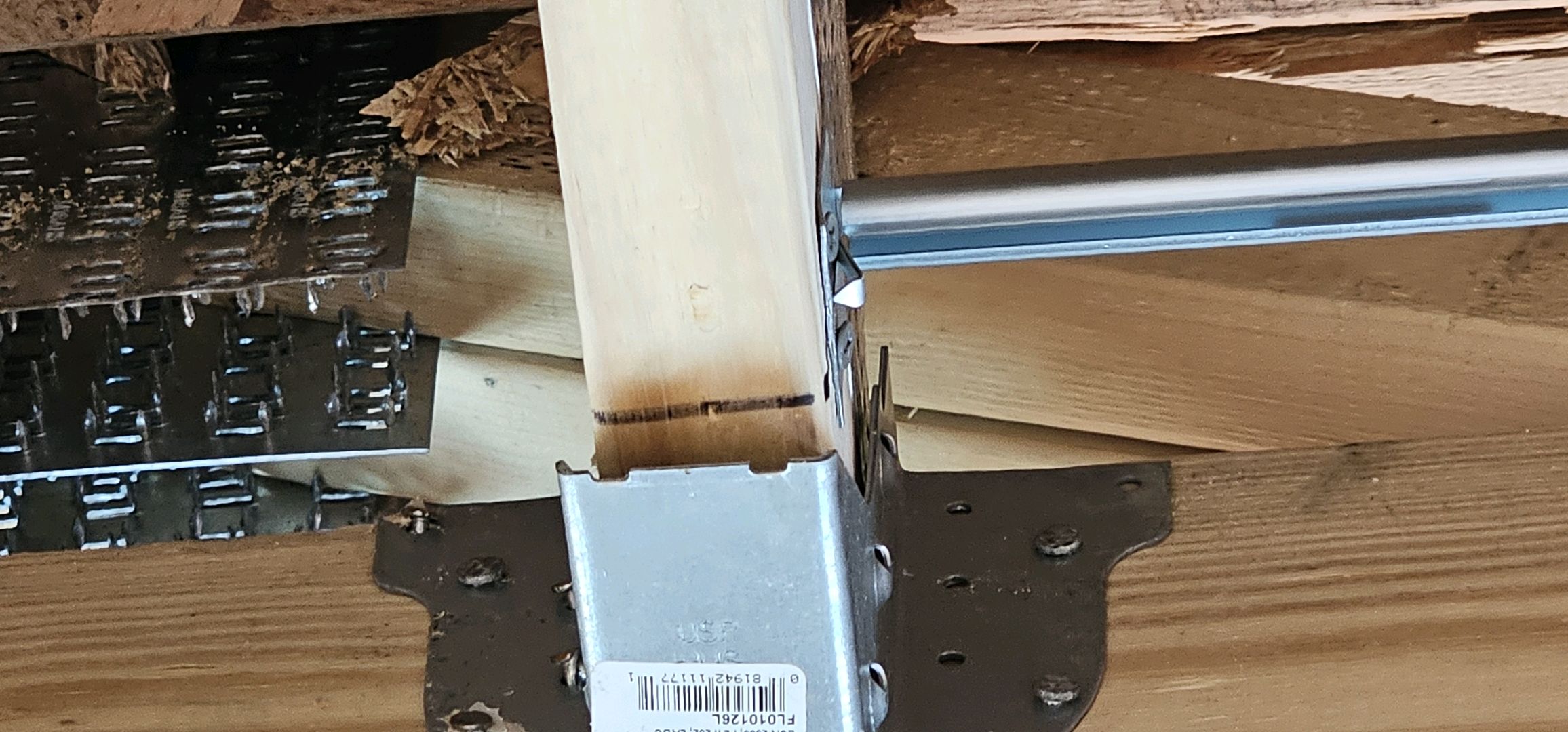 Roof truss not seated correctly in its metal hanger during a ValueGuard pre-drywall inspection