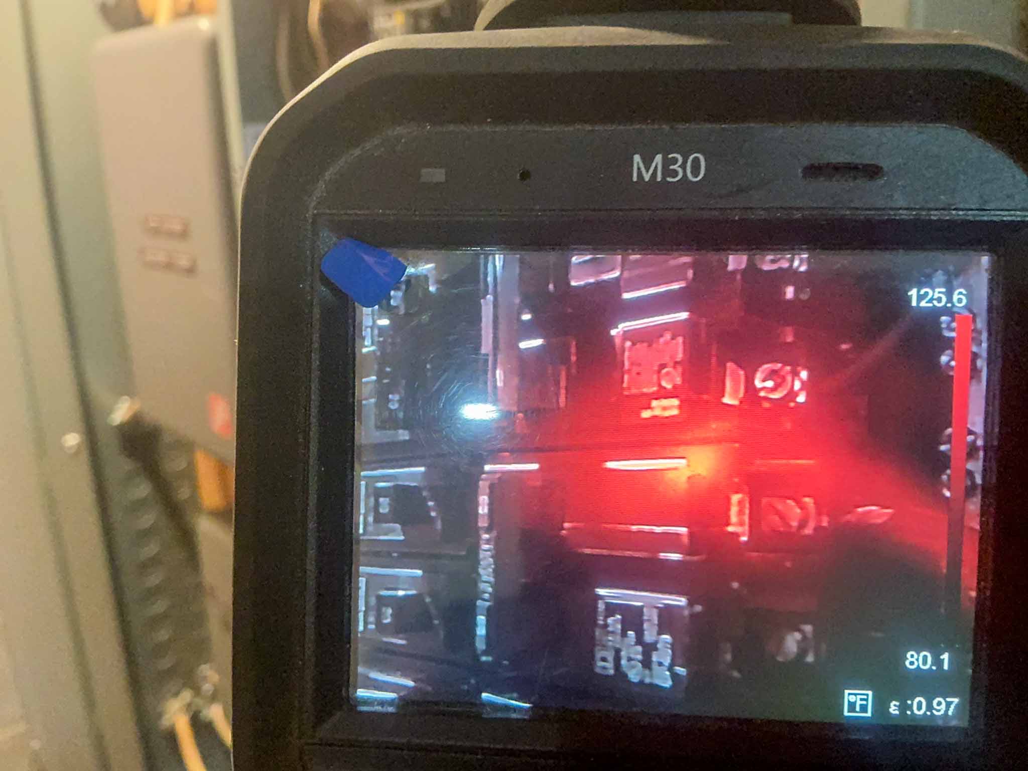 Thermal imaging camera reading 125.6 degrees Fahrenheit at an overheating breaker during a ValueGuard home inspection