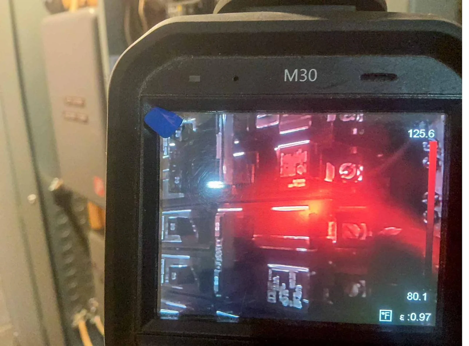 Infrared thermal image of an electrical panel showing a circuit component at 125.6 degrees Fahrenheit during a ValueGuard home inspection