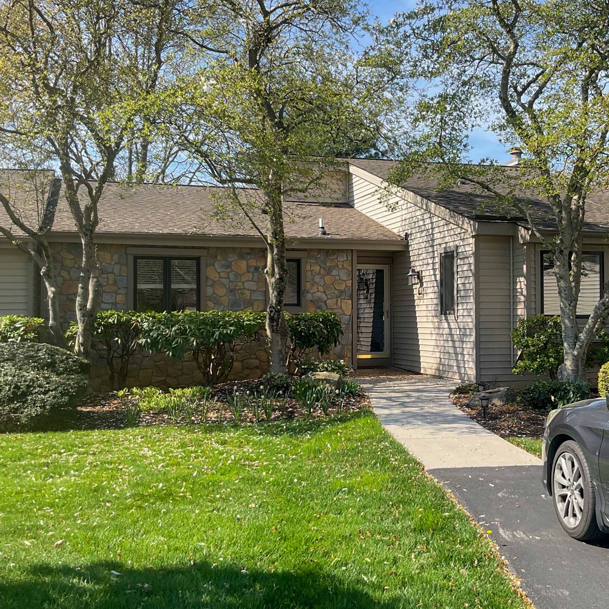 West Chester Home Inspection — Single-Level Ranch Single-level stone-and-siding ranch home with mature landscaping in an established West Chester community, Chester County PA, inspected by a ValueGuard home inspector