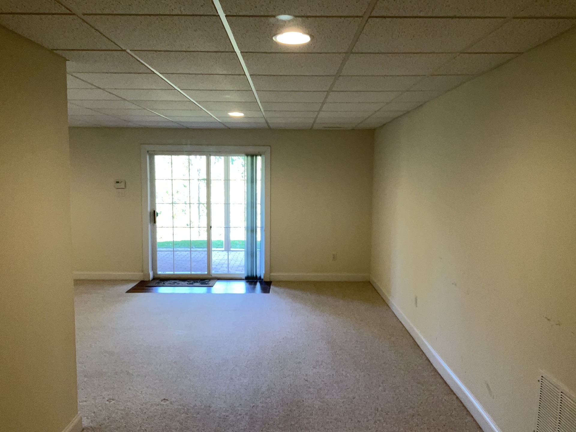 Finished basement family room with the sliding door closed during a winter radon test in Malvern, PA