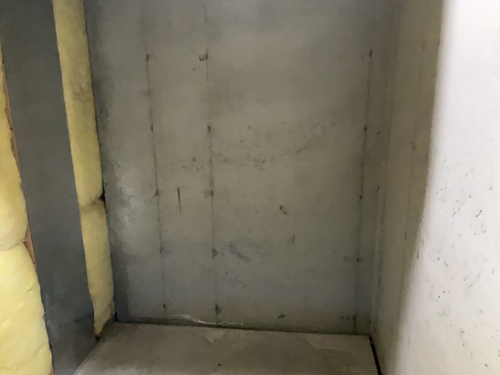 Poured concrete basement foundation wall and floor joint where radon can enter a home